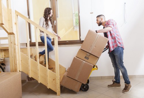 Professional movers handling furniture for a Knightsbridge apartment move