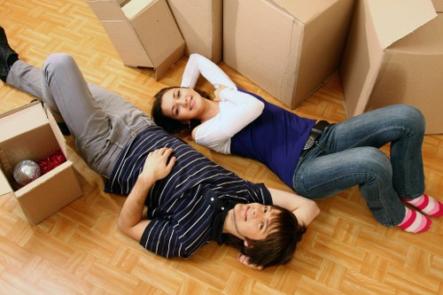 Local team handling office furniture in a central London building